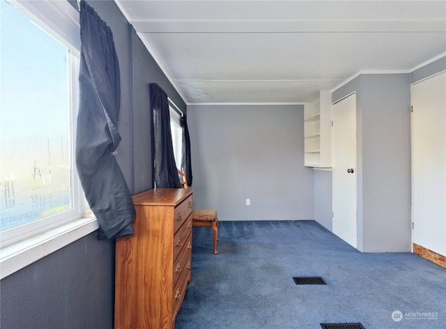 living room with dark carpet and crown molding