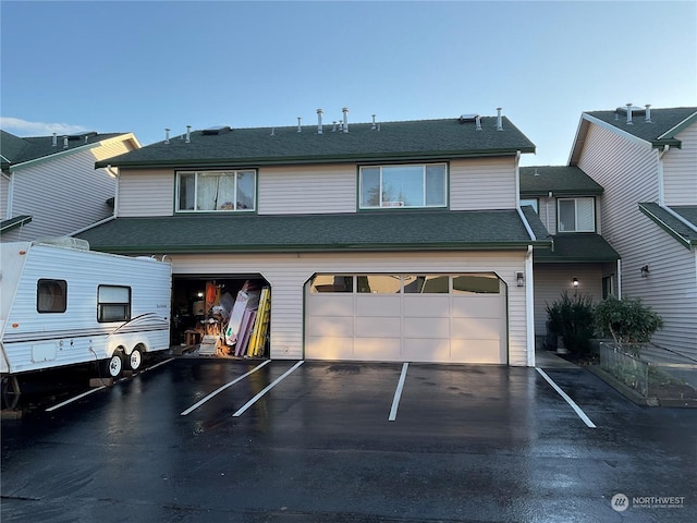 back of house with a garage