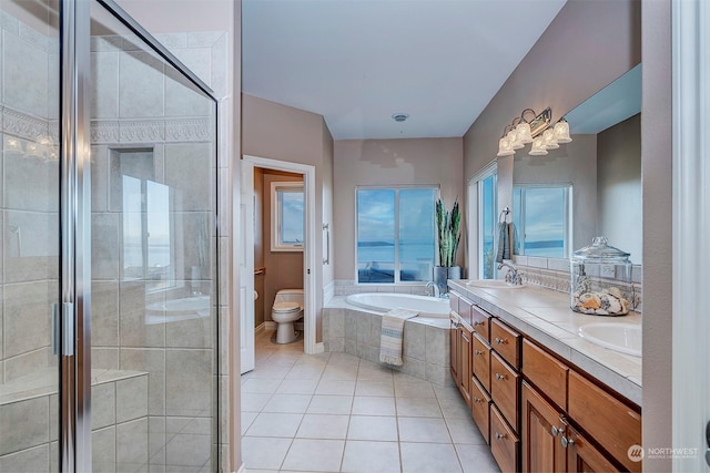 full bathroom with tile patterned flooring, vanity, toilet, and independent shower and bath