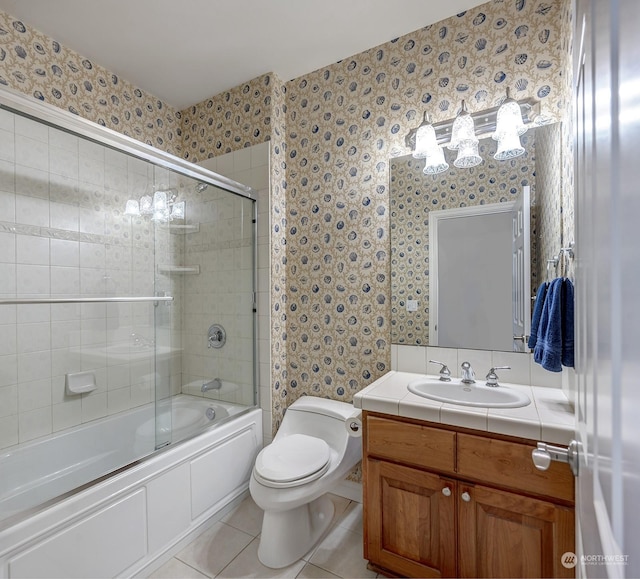 full bathroom with tile patterned flooring, vanity, toilet, and enclosed tub / shower combo