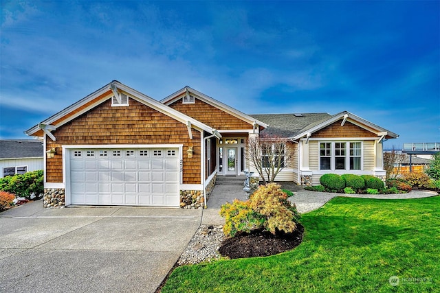 view of front facade featuring a garage and a front lawn