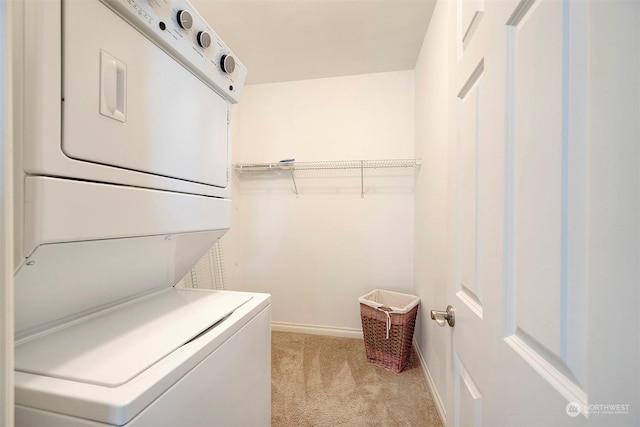 laundry room featuring light carpet and stacked washer and clothes dryer