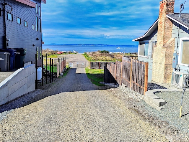 view of yard featuring ac unit and a water view