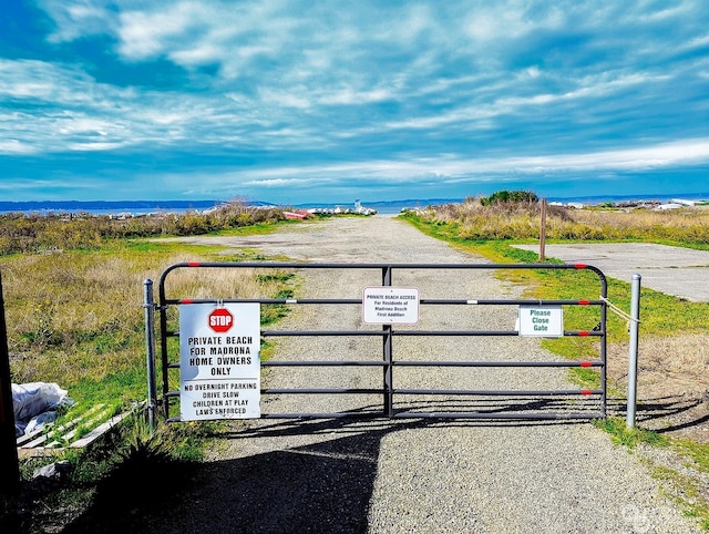 view of gate featuring a water view