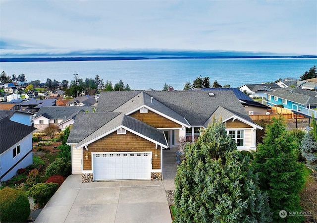 birds eye view of property featuring a water view