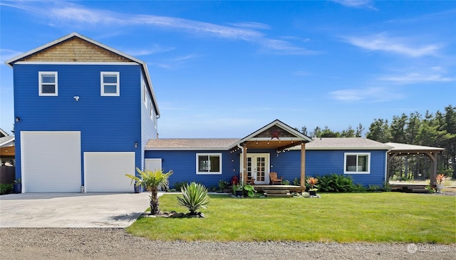 view of front facade with a front yard and a garage