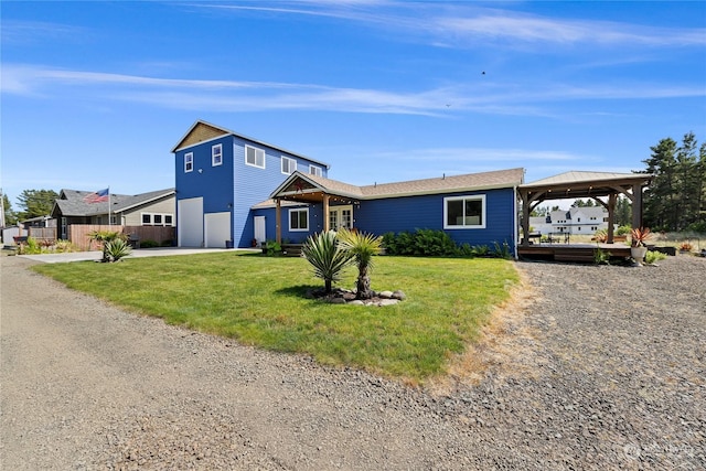 view of front of house with a gazebo, a front lawn, and a garage