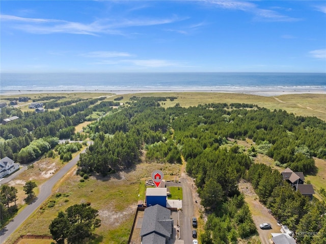 birds eye view of property featuring a view of the beach and a water view