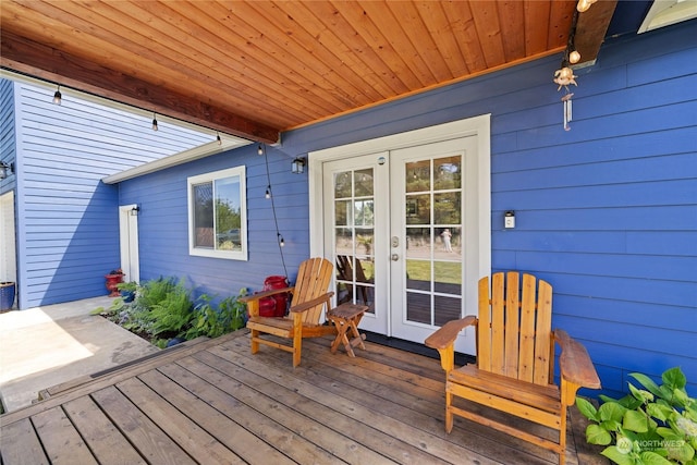 wooden terrace featuring french doors