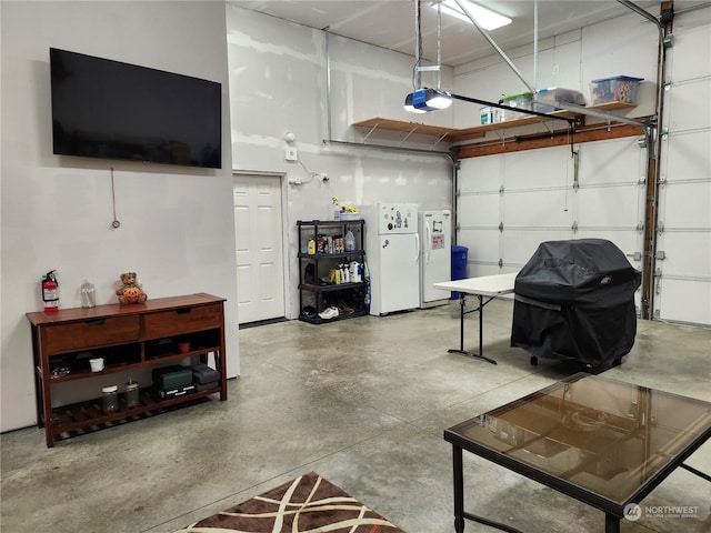 garage with white fridge and a garage door opener