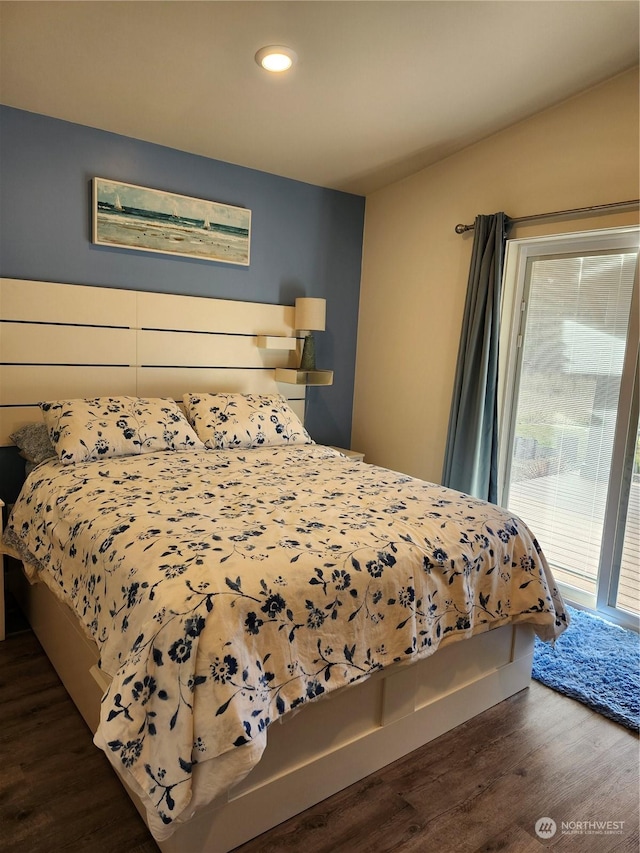 bedroom featuring access to outside and dark wood-type flooring