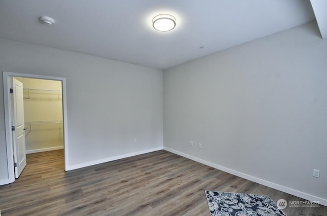 empty room with hardwood / wood-style flooring