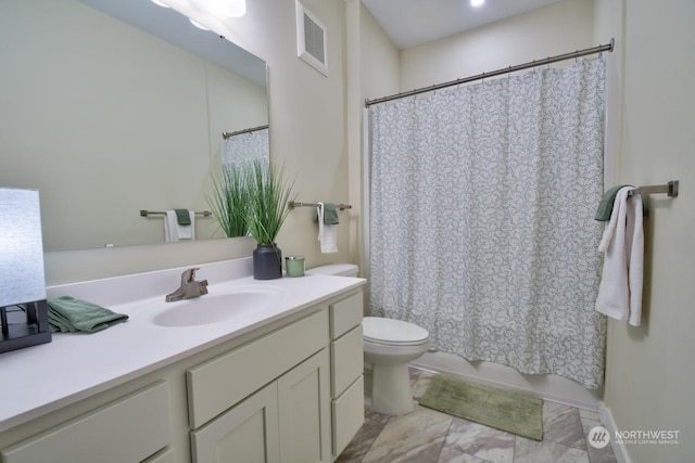 bathroom with toilet and vanity