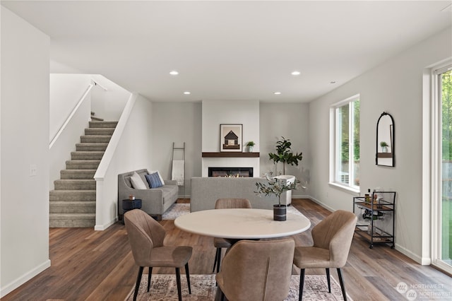 dining space with hardwood / wood-style flooring