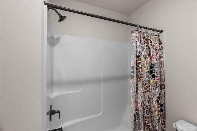 bathroom with curtained shower