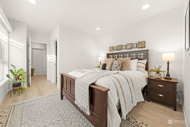 bedroom with light hardwood / wood-style flooring