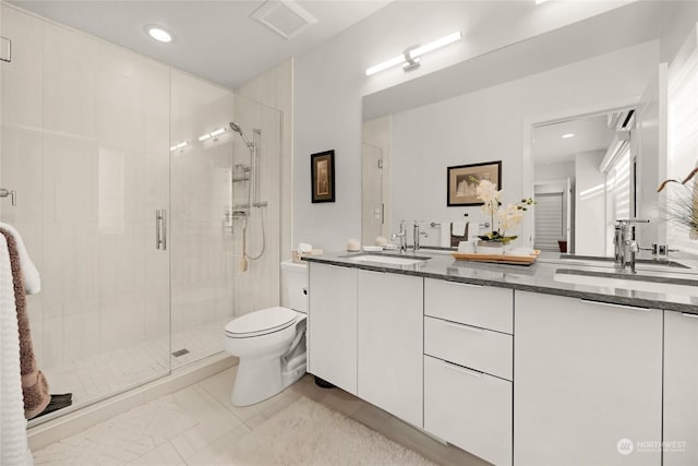 bathroom with vanity, toilet, and walk in shower