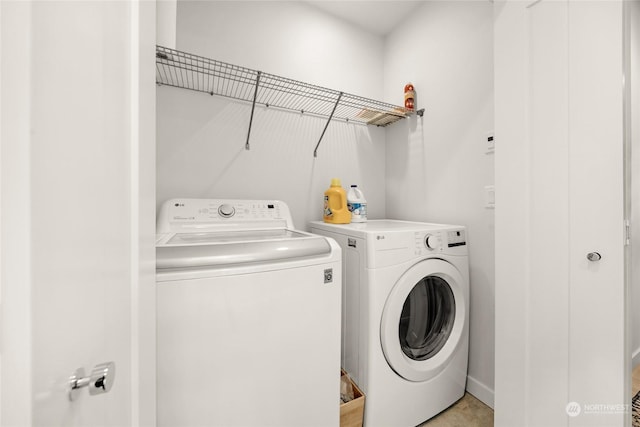 clothes washing area featuring washing machine and clothes dryer