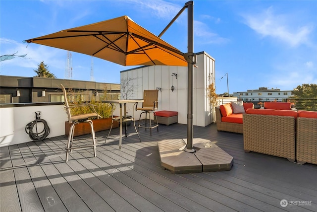 wooden deck featuring outdoor lounge area