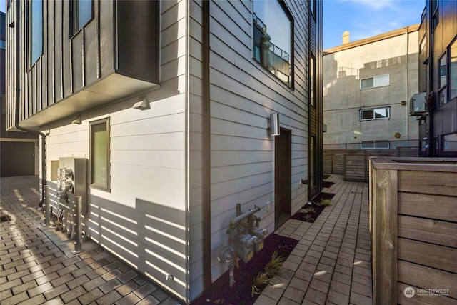 view of side of property with a patio