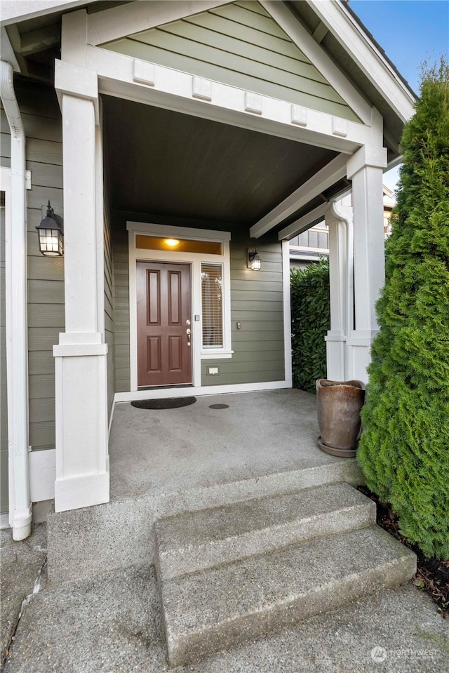 doorway to property with covered porch