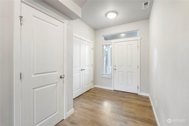 foyer entrance featuring light wood-type flooring