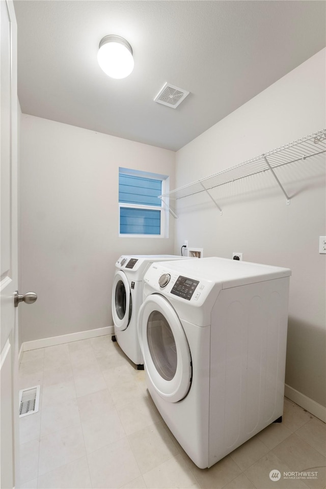 laundry area featuring separate washer and dryer