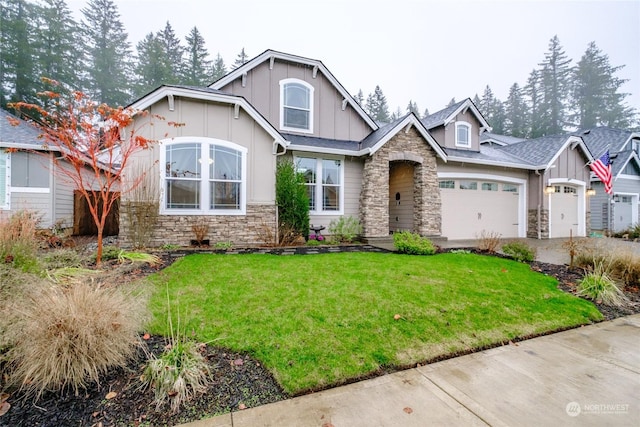 craftsman-style house with a garage and a front lawn