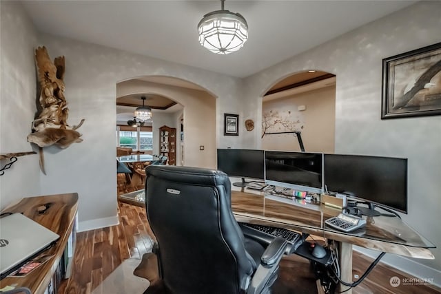 home office with hardwood / wood-style flooring and an inviting chandelier