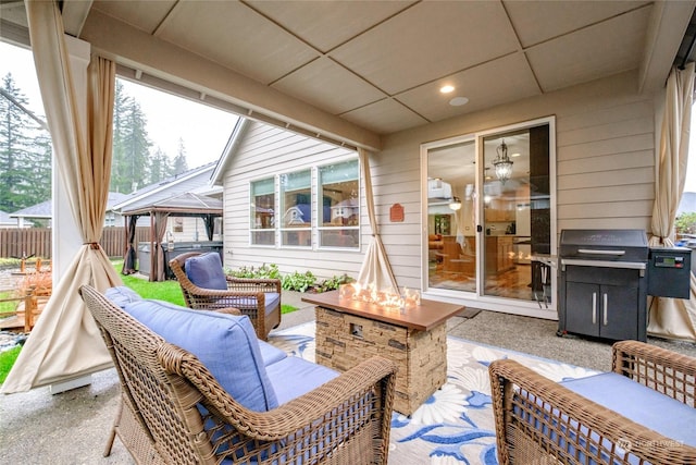 view of patio / terrace featuring a gazebo, grilling area, and an outdoor living space