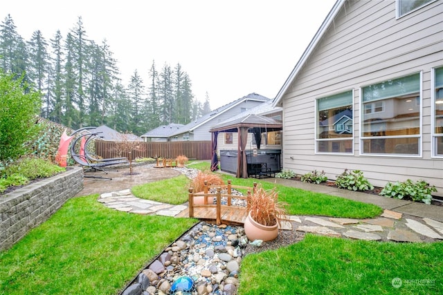 view of yard featuring a hot tub and a patio area