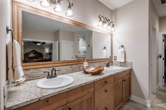 bathroom with vanity, backsplash, and tile patterned floors