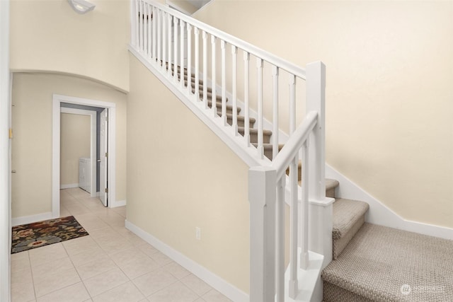 stairs with tile patterned floors