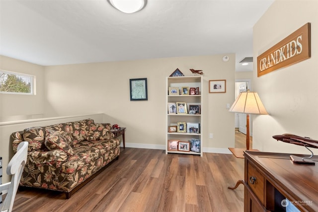 sitting room with dark hardwood / wood-style floors