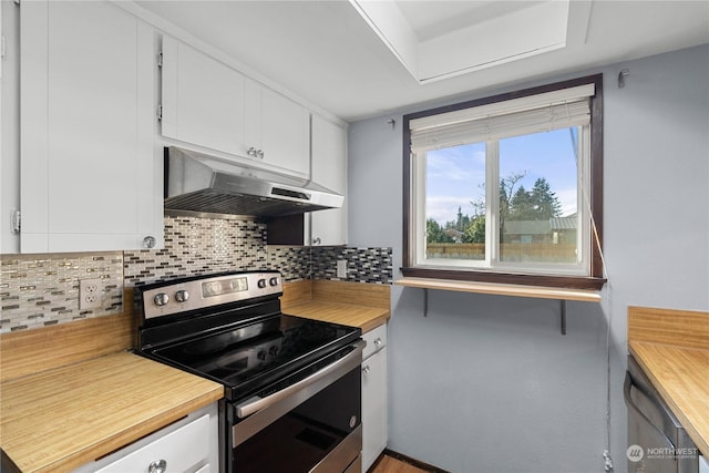 kitchen featuring decorative backsplash, white cabinetry, and stainless steel range with electric stovetop