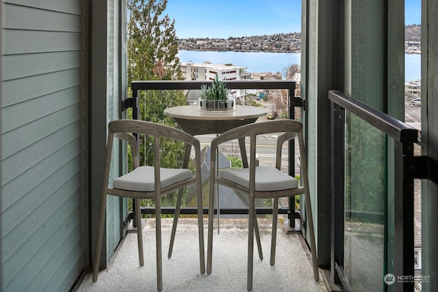 balcony featuring a water view