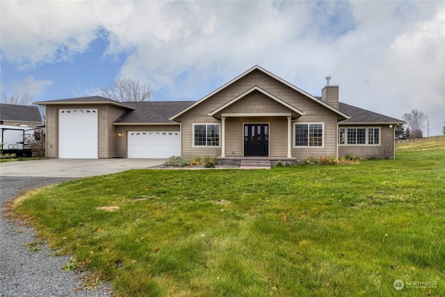 view of front facade with a front yard and a garage