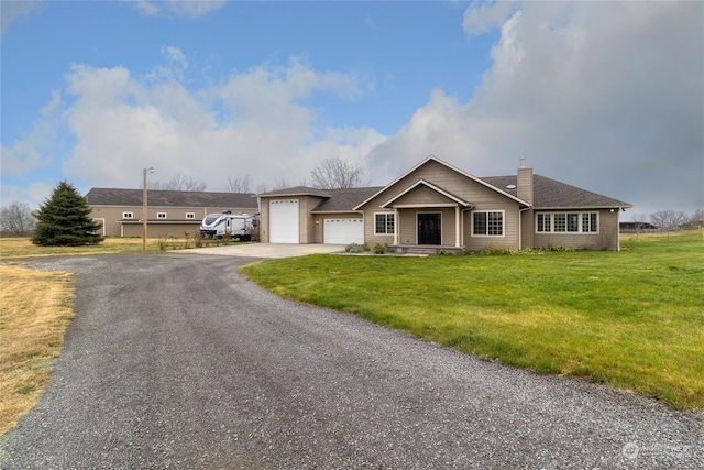 view of front of house with a front lawn and a garage