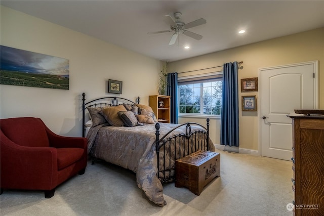 bedroom featuring ceiling fan and light carpet