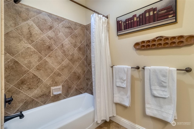 bathroom with shower / bathtub combination with curtain