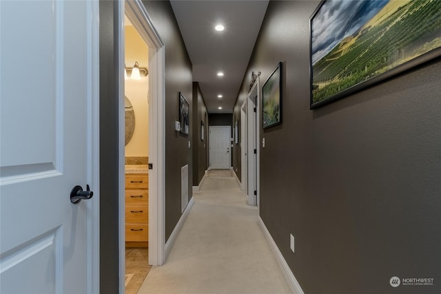 corridor with light colored carpet