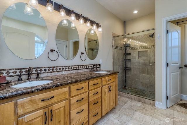 bathroom with vanity and a shower with shower door