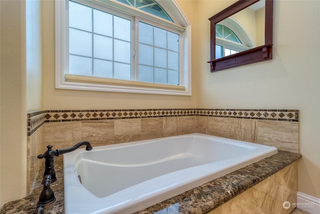 bathroom with a tub to relax in