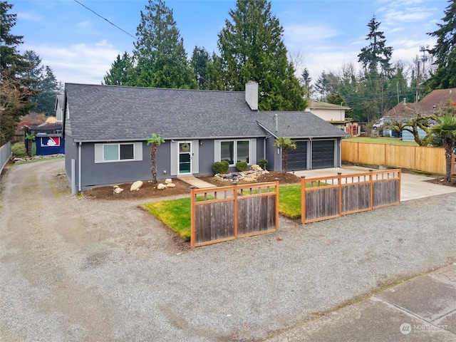 single story home with a garage