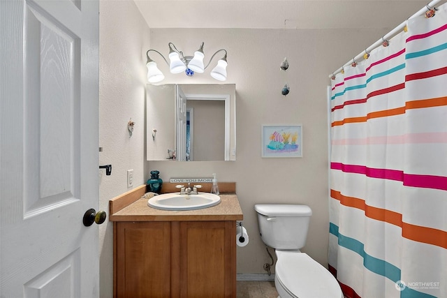 bathroom featuring vanity, curtained shower, and toilet