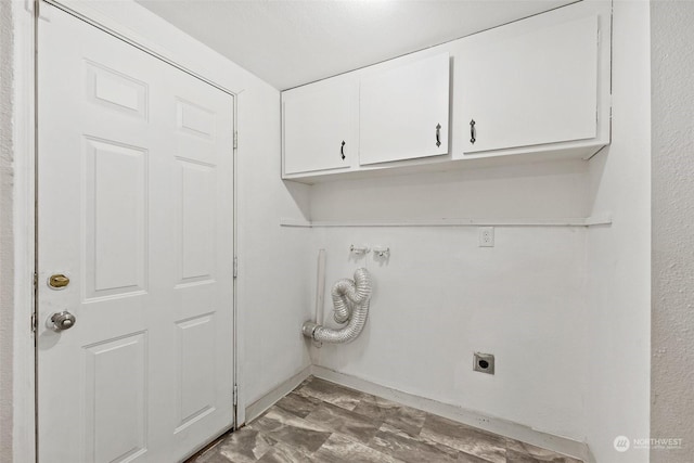 washroom featuring cabinets and hookup for an electric dryer