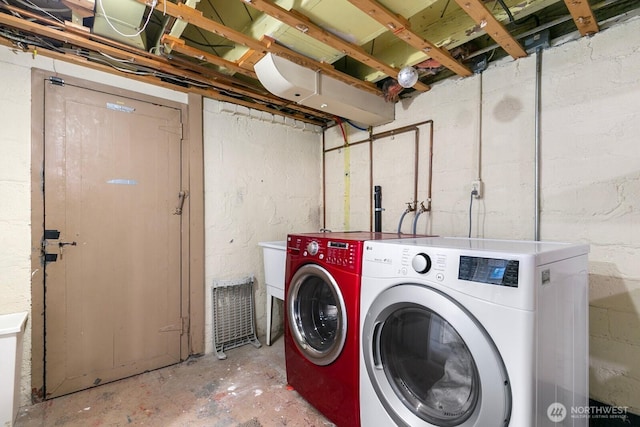 laundry area featuring laundry area and washer and dryer