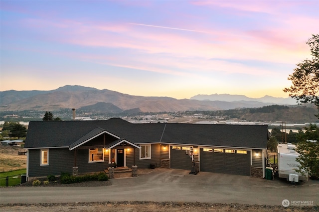 view of front of home featuring a mountain view and a garage