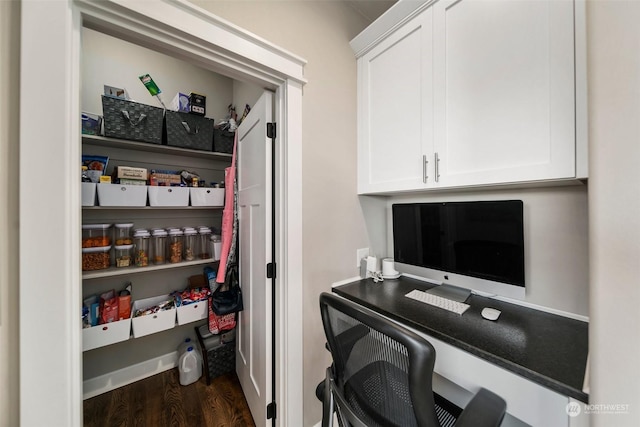 office with dark hardwood / wood-style floors