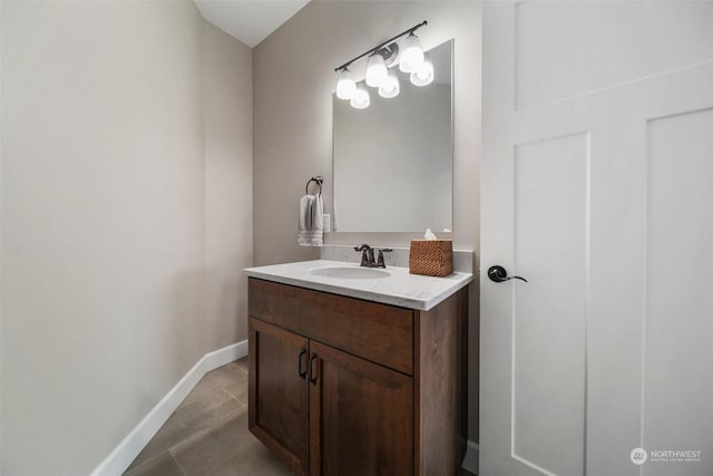 bathroom with tile patterned floors and vanity